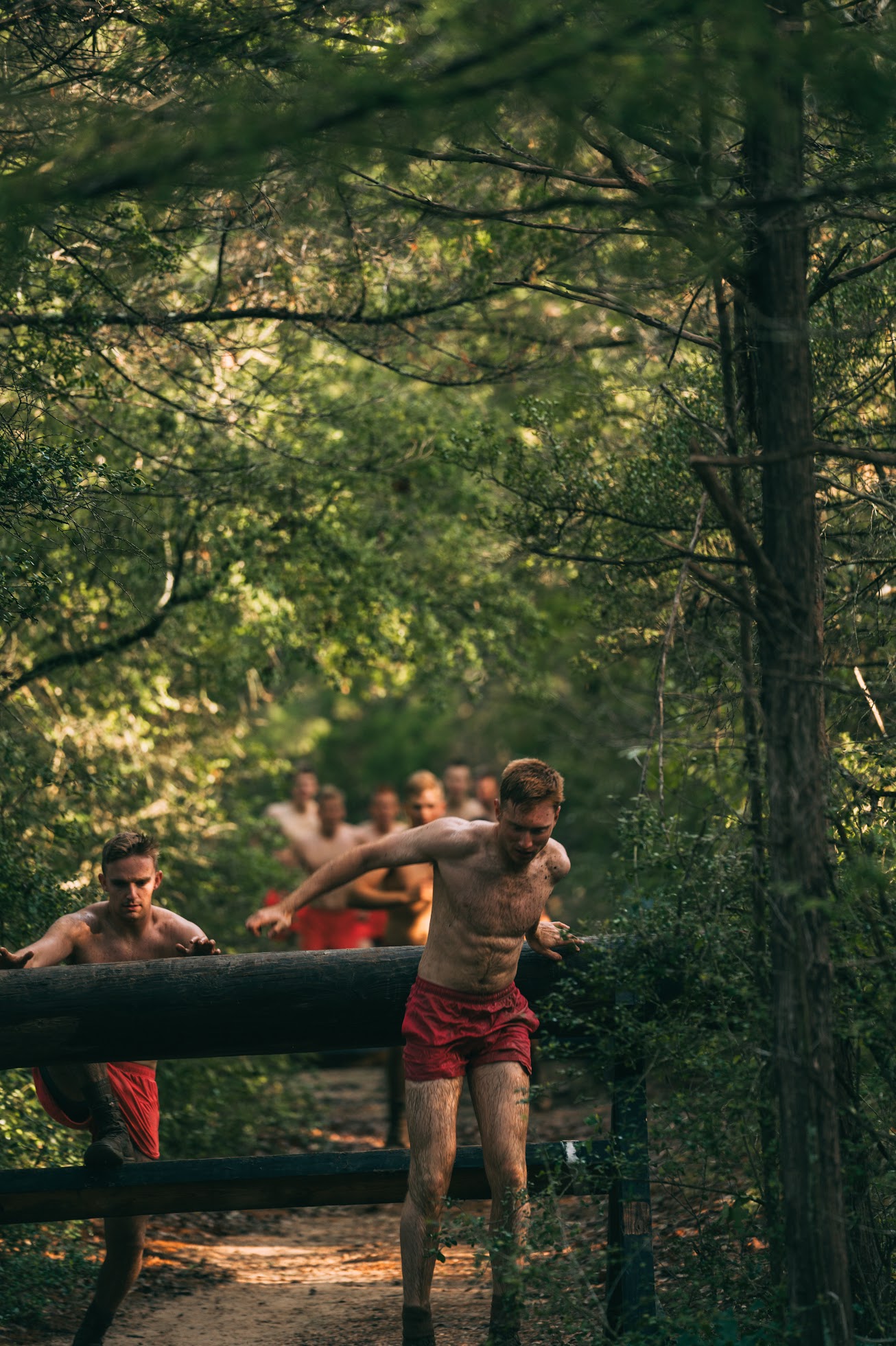 Racers crossing the Log Hurdles obstacle